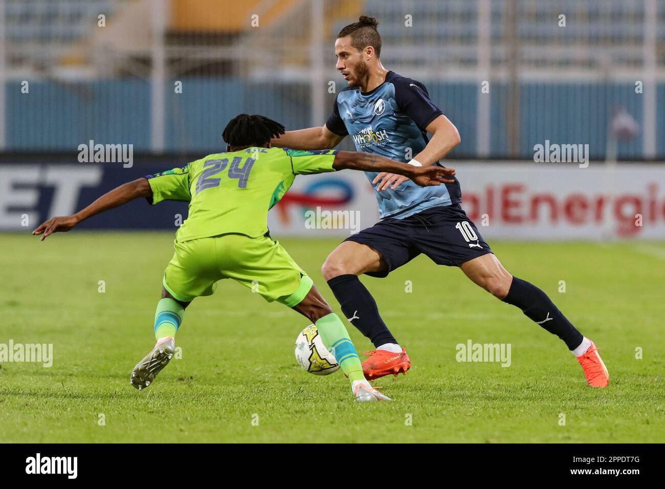 Cairo, Egypt. 23rd Apr, 2023. Ramadan Sobhi (R) of Pyramids FC competes with Mpho Mvelase of Marumo Gallants during the Confederation of African Football (CAF) Confederation Cup quarterfinal match between Pyramids FC and Marumo Gallants in Cairo, Egypt, on April 23, 2023. Credit: Ahmed Gomaa/Xinhua/Alamy Live News Stock Photo