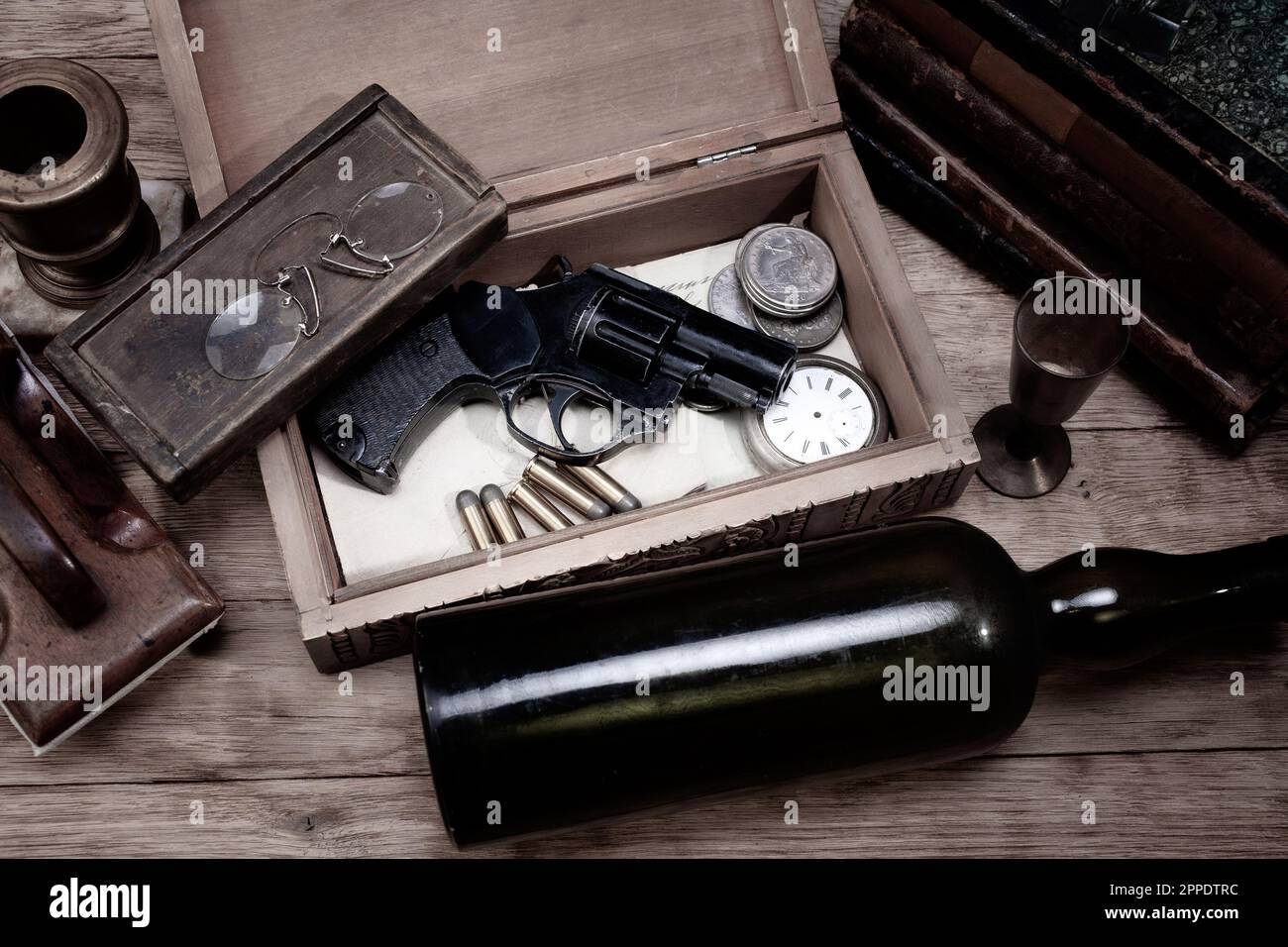 Antique retro vintage revolver gun with ammunitions in wooden box for
