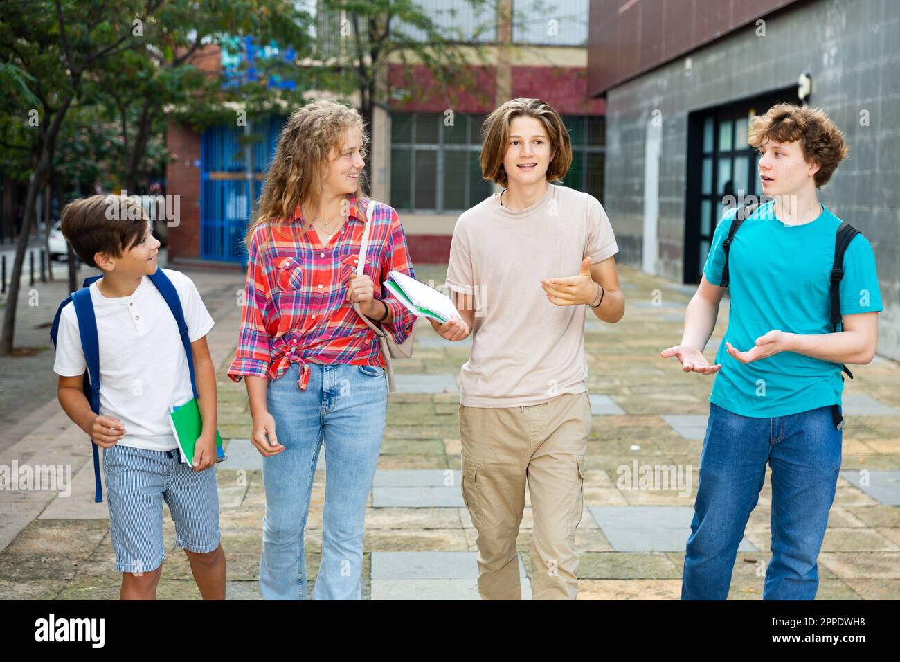 School friends walk after class Stock Photo - Alamy