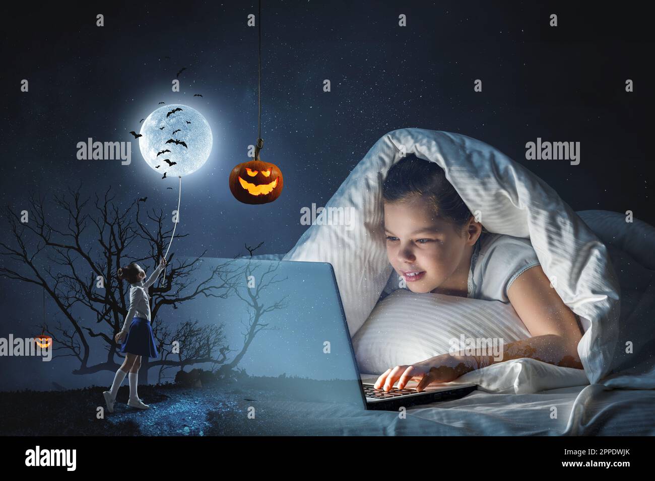 Little girl in front of computer Stock Photo - Alamy