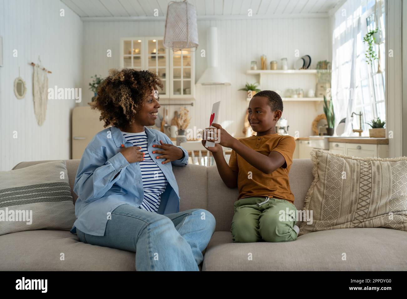 Happy African American family mom and son celebrating Mothers Day ...
