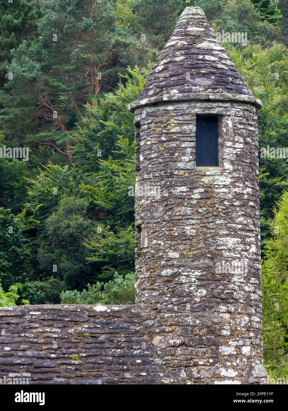 The tower of the ancient Saint Kevin's Kitchen at Glendalough Monastic City in Wicklow Mountains National Park, Ireland. Stock Photo