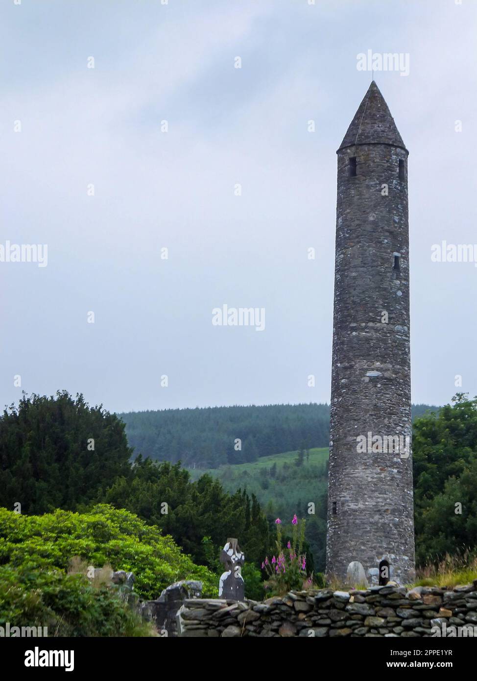 The ancient Round Tower of Saint Kevin's Monastery at Glendalough Monastic City in Wicklow Mountains National Park, Ireland. Stock Photo