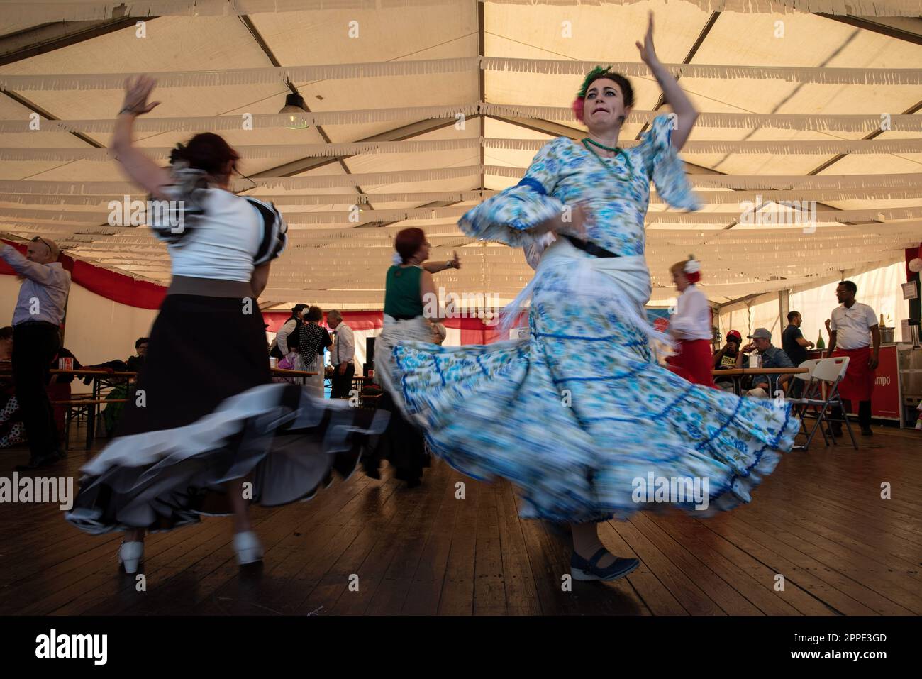 Barcelona, Spain. 23rd Apr, 2023. Women wearing typical Sevillian costumes  (round dresses), dance Sevillanas during the 50th anniversary of the April  Fair in Barcelona. Thousands of people visited the Feria de Abril