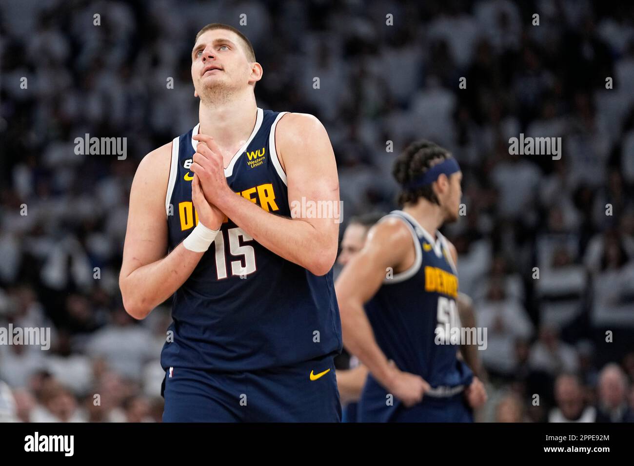 Denver Nuggets center Nikola Jokic (15) walks towards the team bench during overtime of Game 4 of an NBA basketball first-round playoff series against the Minnesota Timberwolves, Sunday, April 23, 2023, in Minneapolis. (AP Photo/Abbie Parr) Stock Photo
