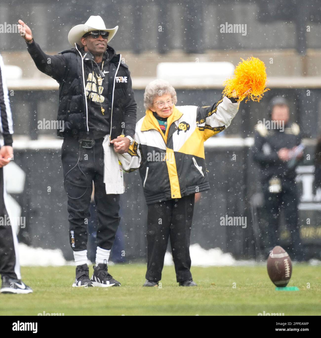 Colorado head coach Deion Sanders and fan Peggy Coppom in the first