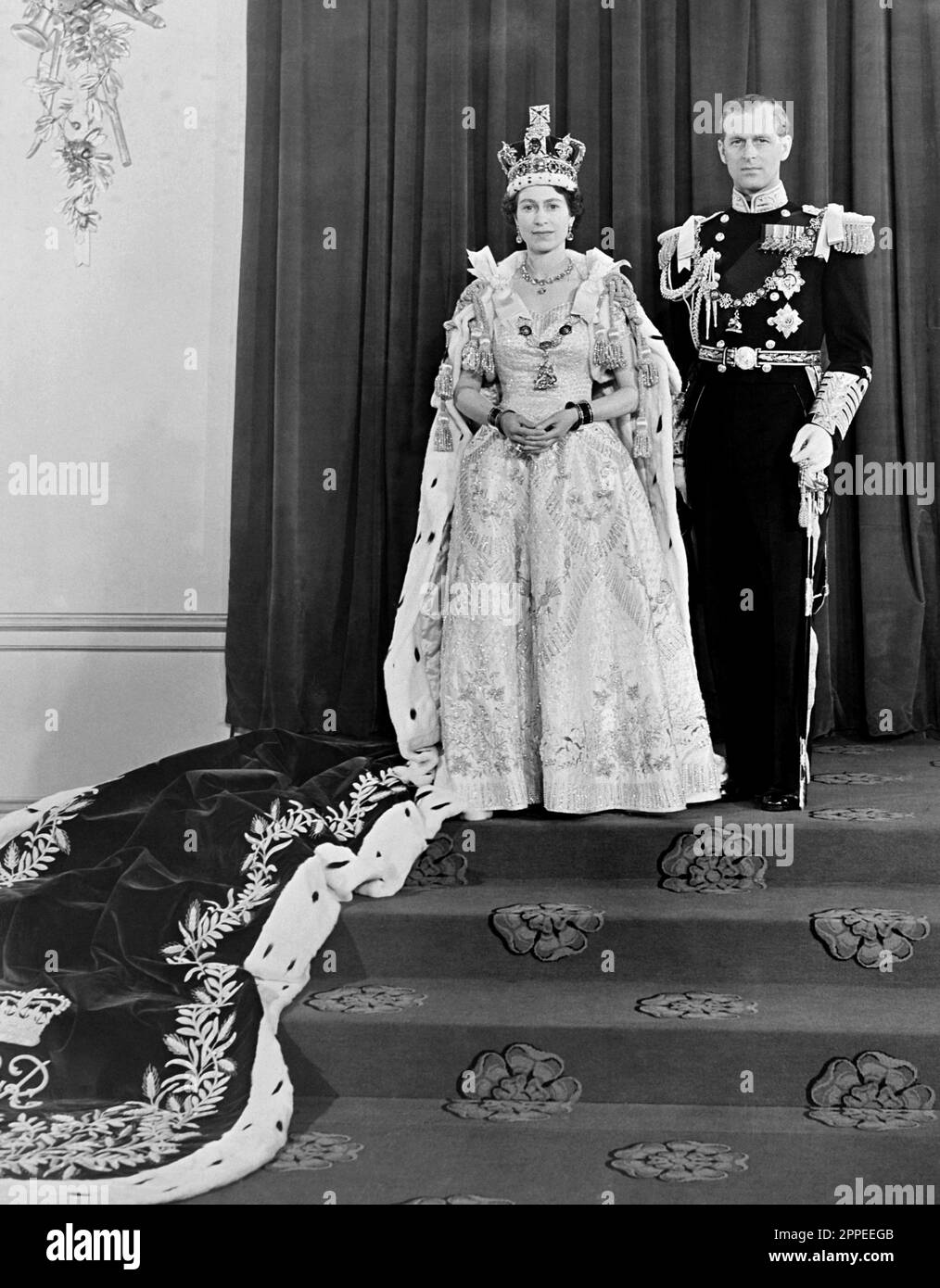 File photo dated 02/06/53 of Queen Elizabeth II and her husband the Duke of Edinburgh at Buckingham Palace after her coronation in Westminster Abbey. King Charles III's coronation will take place on May 6, in a ceremony steeped in 1,000 years of history. The King will be crowned with the historic St Edward's Crown - the same one his mother, Queen Elizabeth II, was crowned with. Issue date: Monday April 24, 2023. Stock Photo