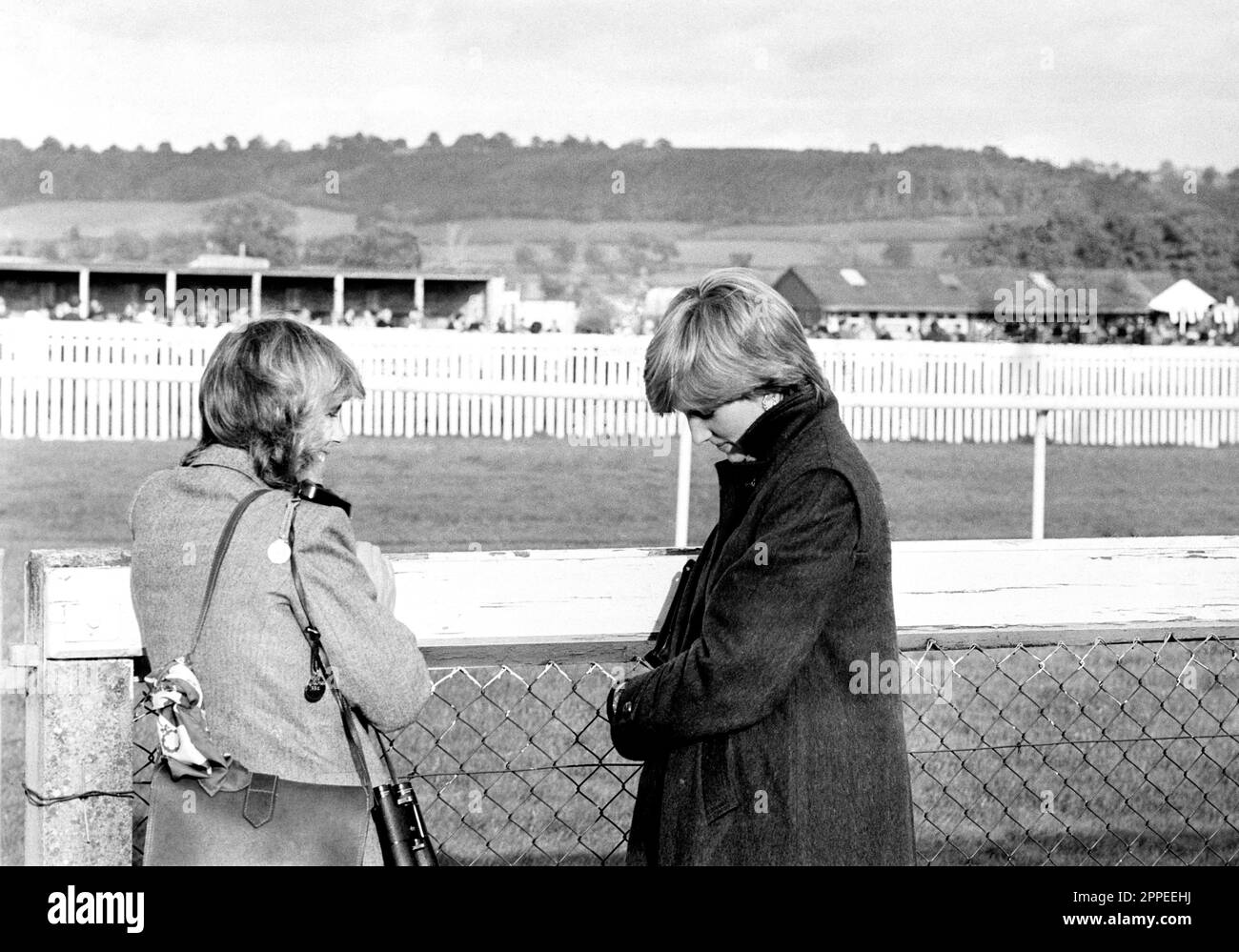 BLACK AND WHITE ONLY File photo dated 24/10/80 of, Camilla Parker-Bowles (left) now Queen Consort and Lady Diana Spencer (later the Princess of Wales) at Ludlow racecourse watching the Amateur Riders Handicap Steeplechase in which the Prince of Wales was competing. The Queen Consort will be crowned beside her husband the King, a symbolic moment that will seal Camilla's place in the history of the monarchy. Issue date: Monday April 24, 2023. Stock Photo
