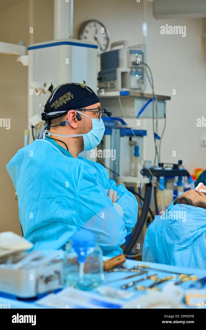 plastic surgeon operates on a patient in the operating room Stock Photo