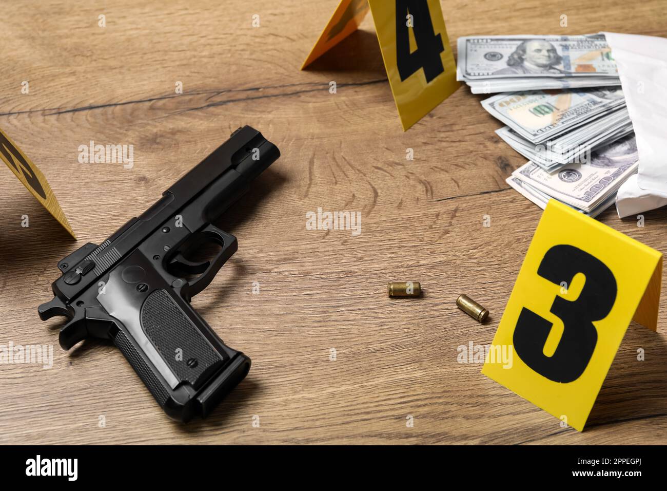 Gun, money and shell casings on wooden background. Crime scene Stock ...