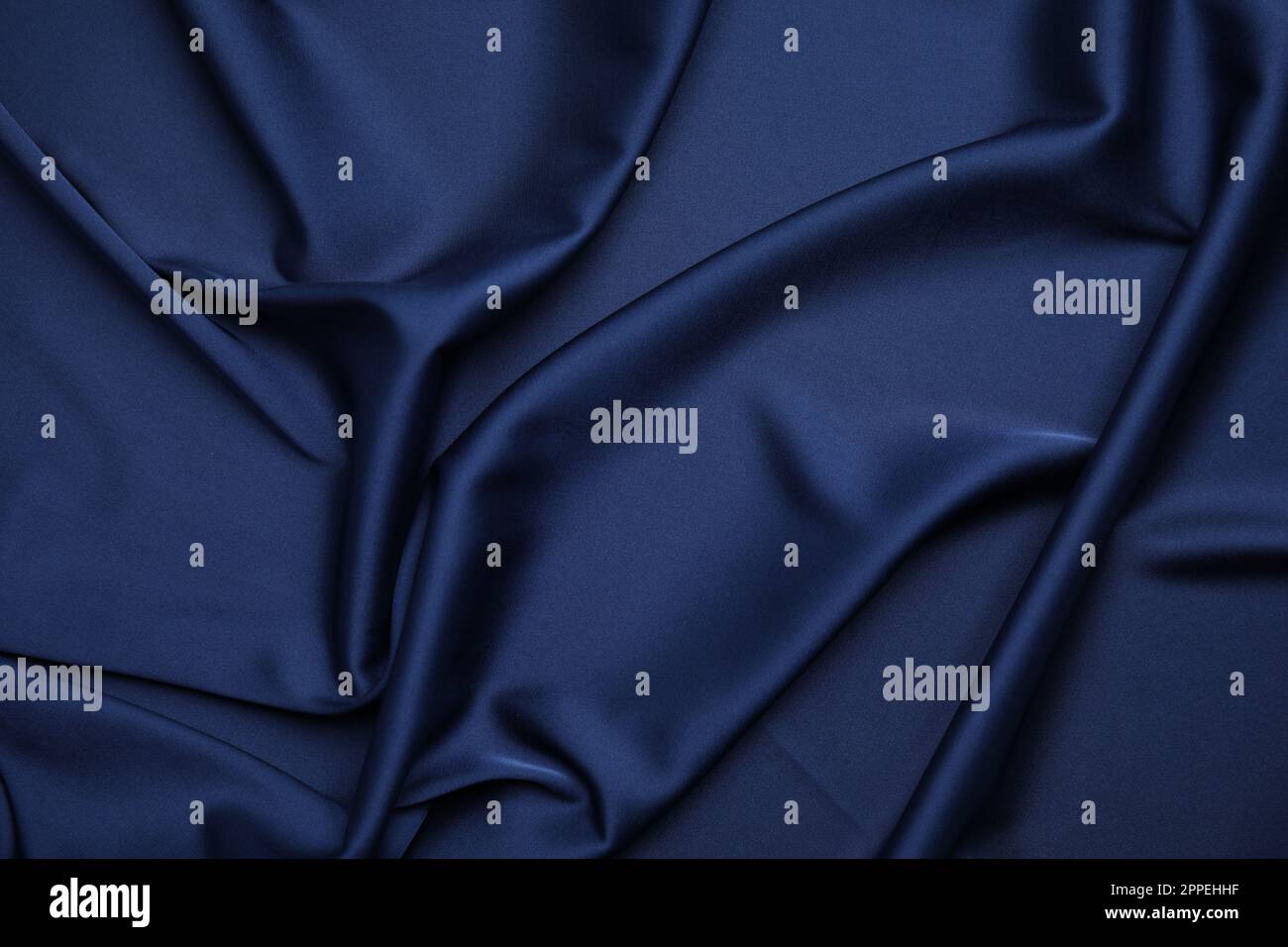 Crumpled dark blue silk fabric as background, top view Stock Photo - Alamy