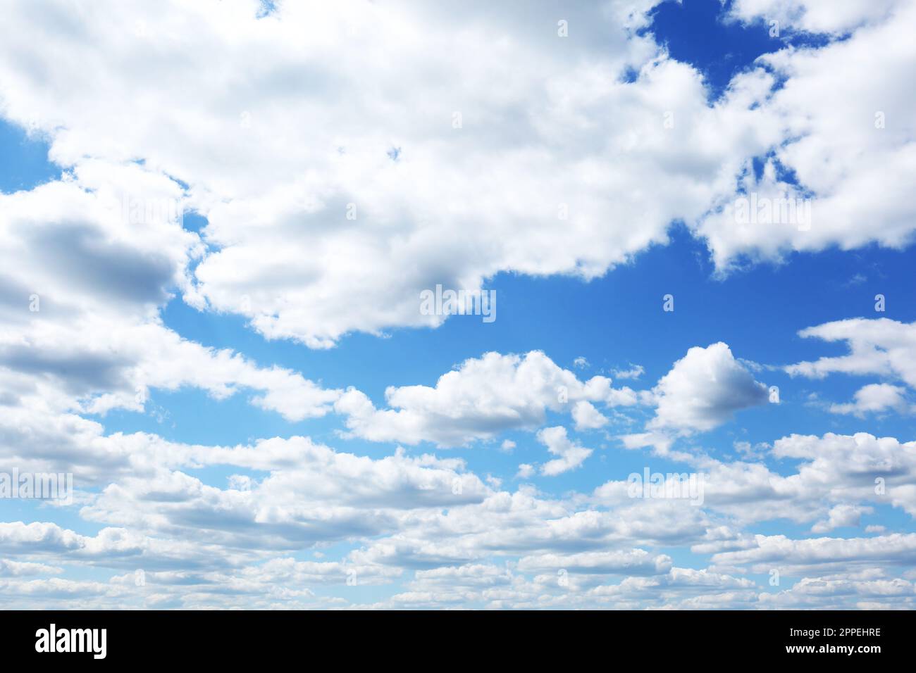 Picturesque view of blue sky with fluffy clouds Stock Photo - Alamy