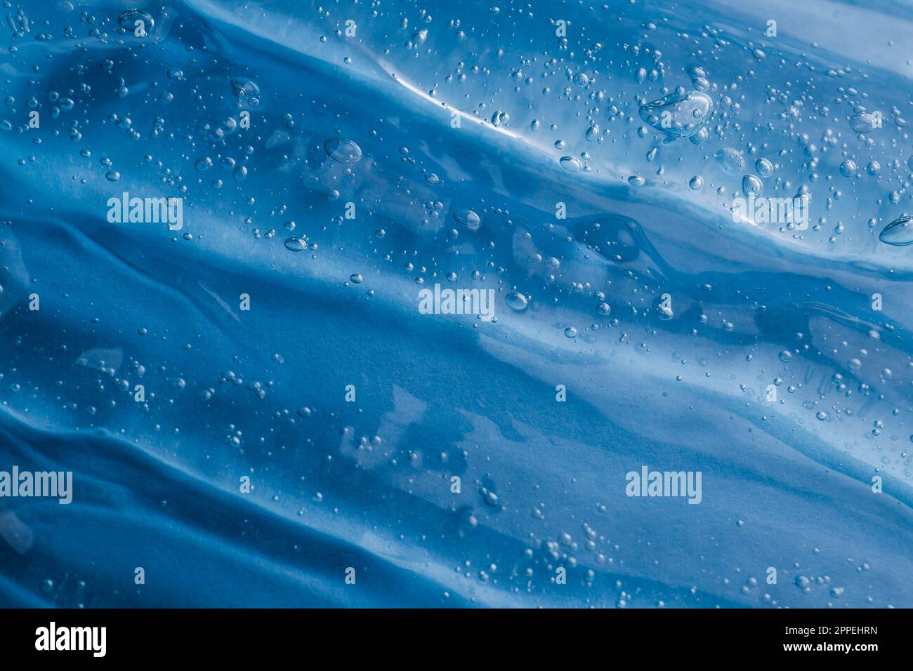Texture of light blue shower gel as background, top view Stock Photo