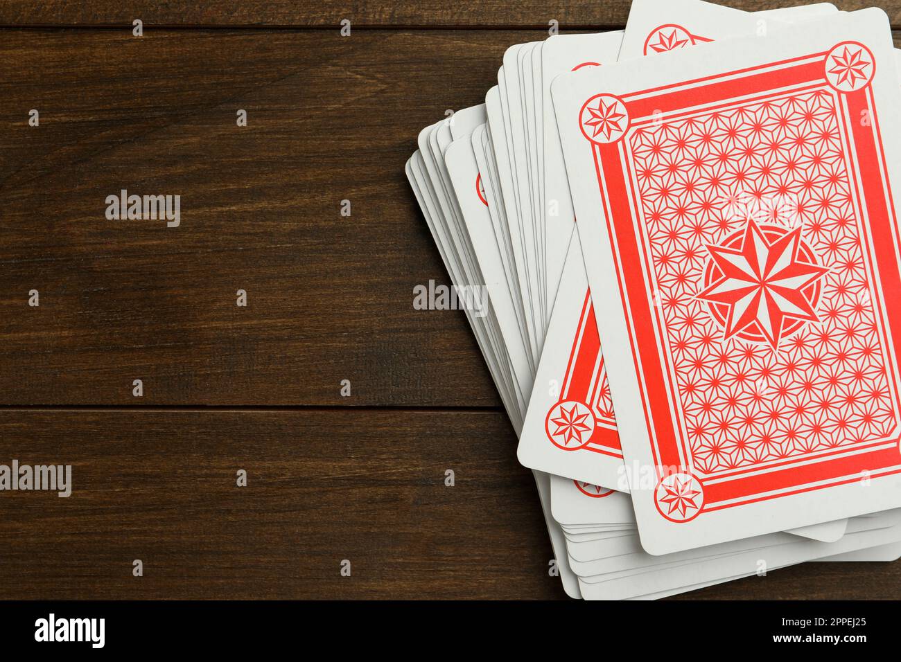 Deck of playing cards on wooden table, top view. Space for text Stock Photo Alamy