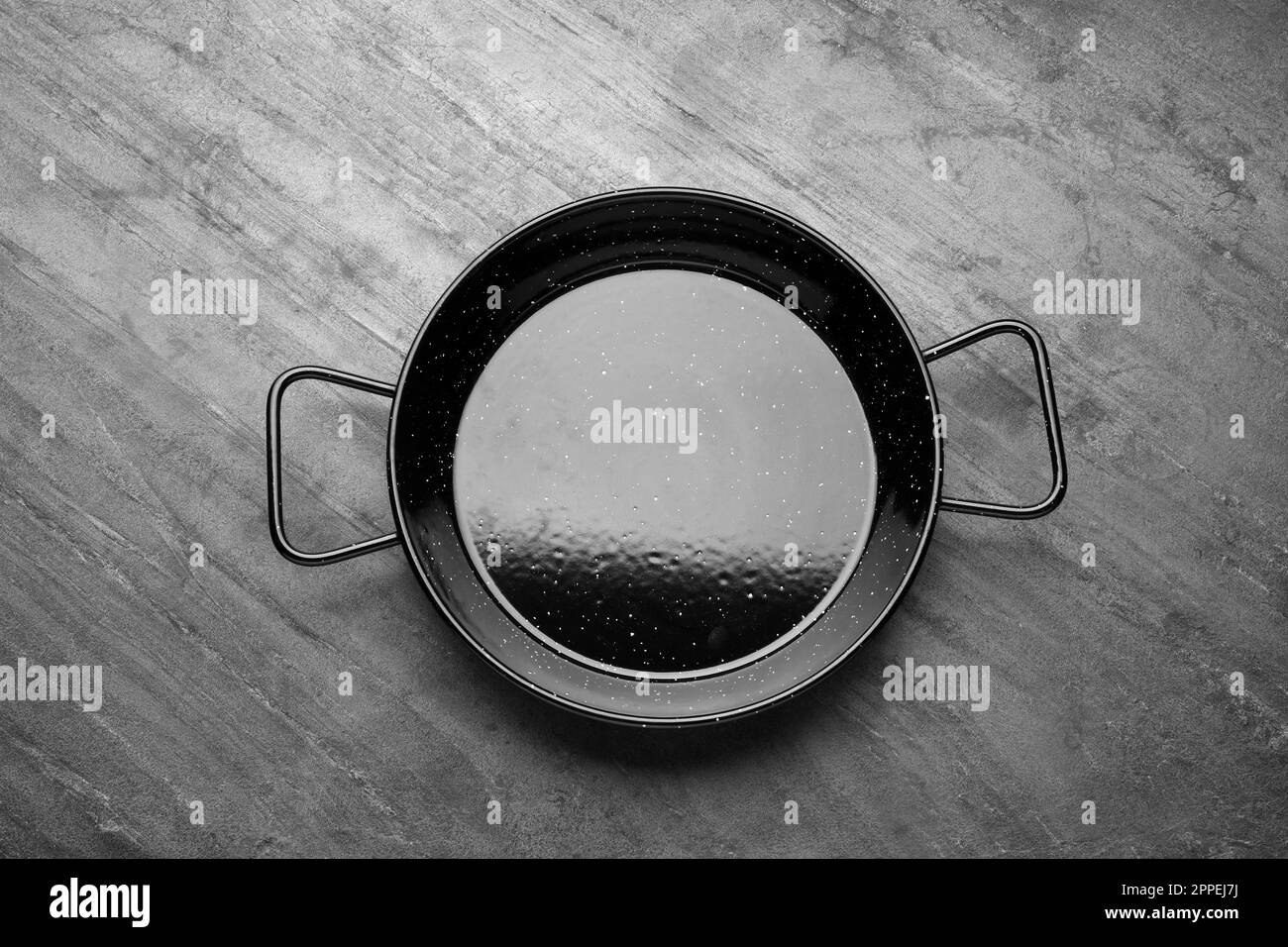 New stir-fry pan on grey table, top view Stock Photo