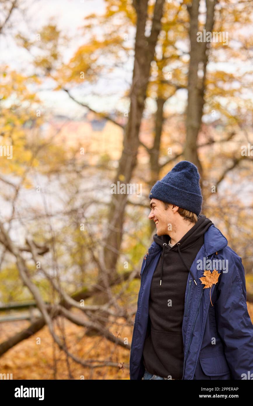 Smiling young man looking away Stock Photo