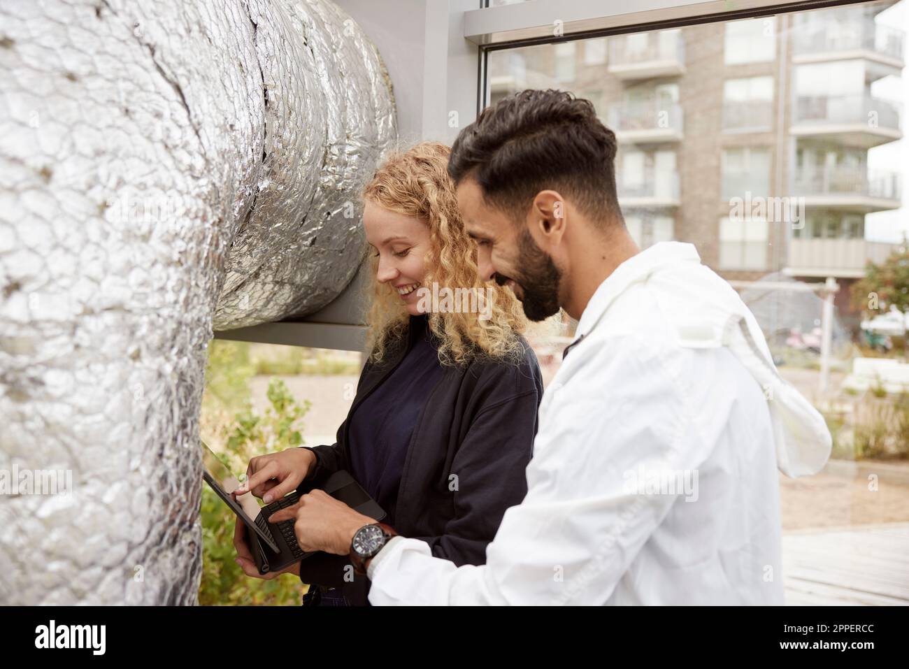 Man and woman using digital tablet Stock Photo