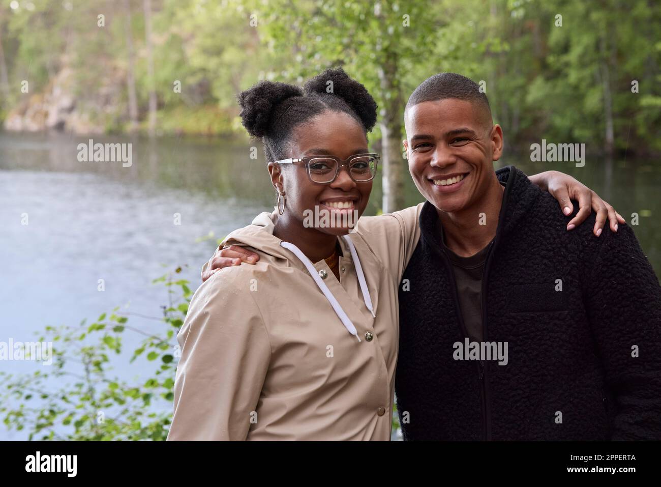 Smiling friends looking at camera Stock Photo