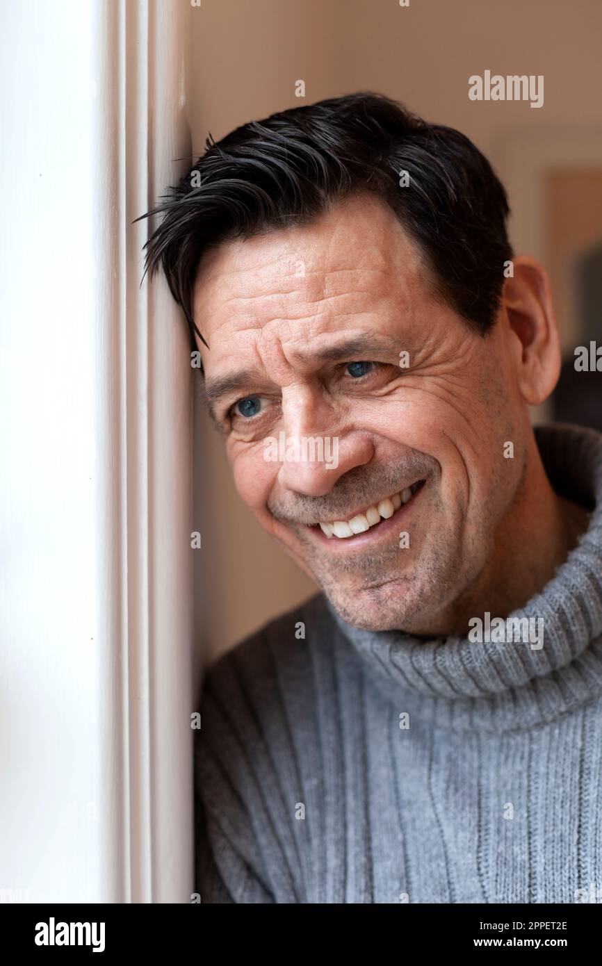 Smiling man looking away Stock Photo