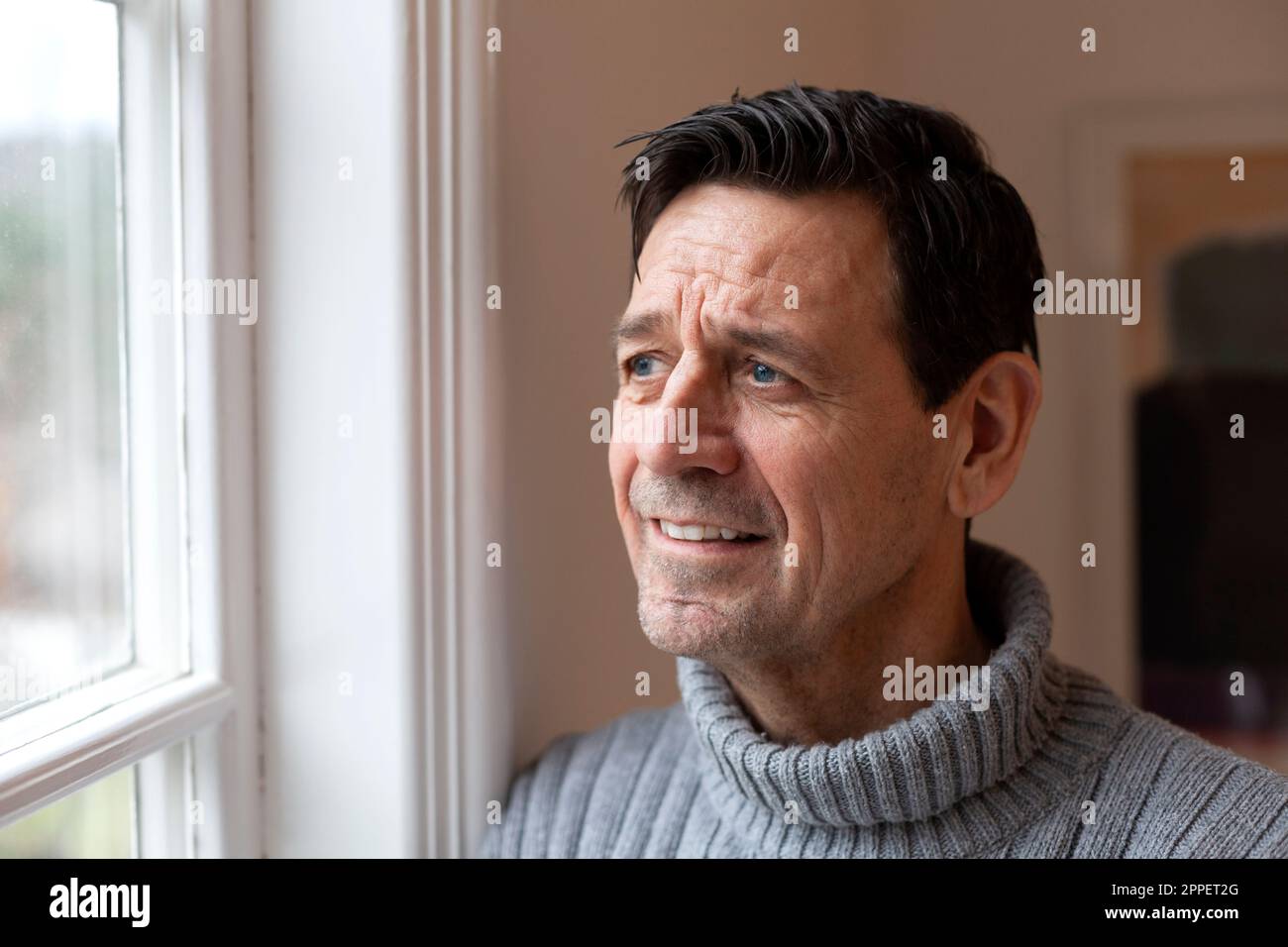 Smiling man looking away Stock Photo