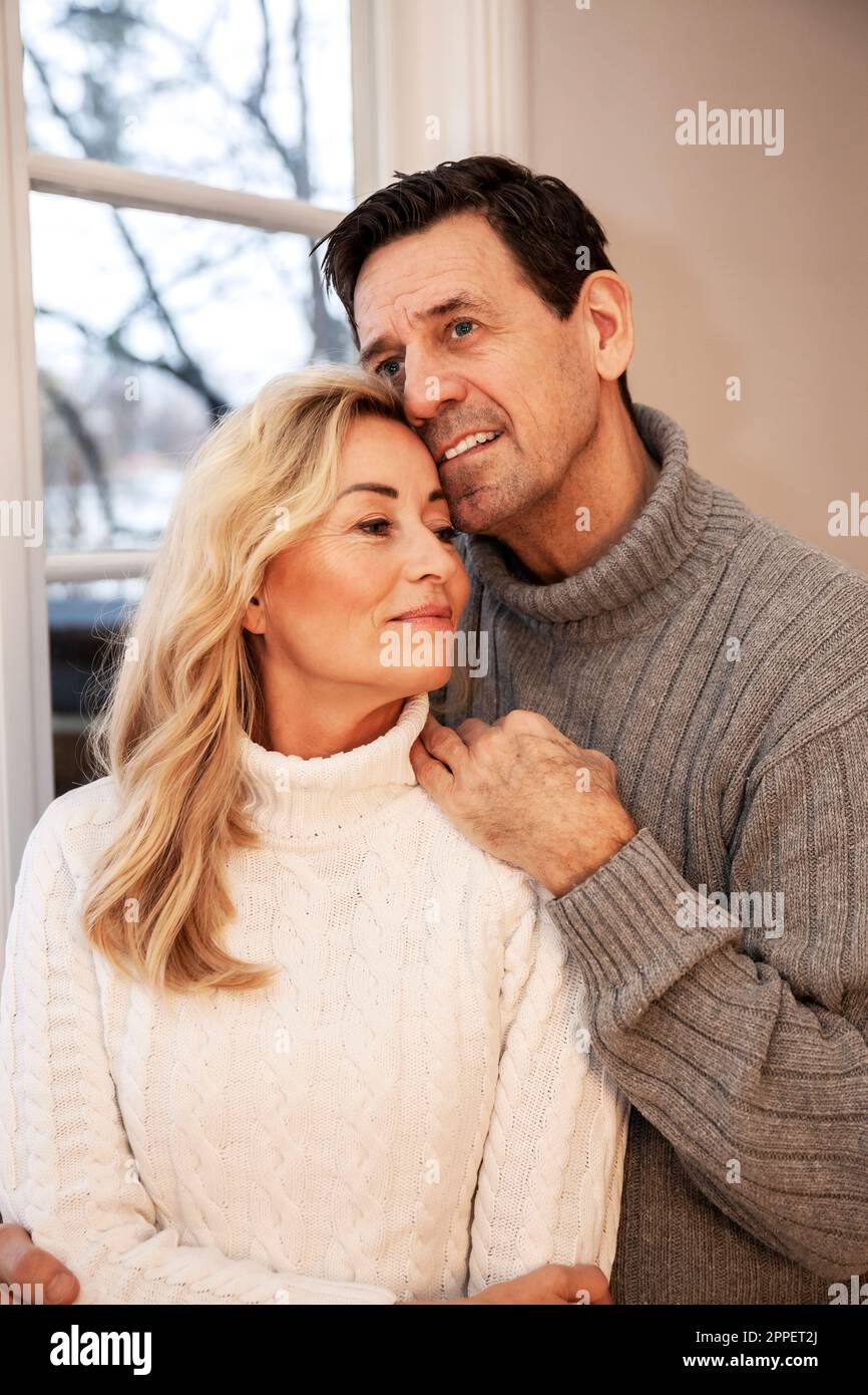 Smiling couple sitting together Stock Photo