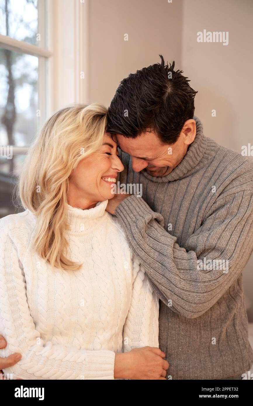 Smiling couple sitting together Stock Photo