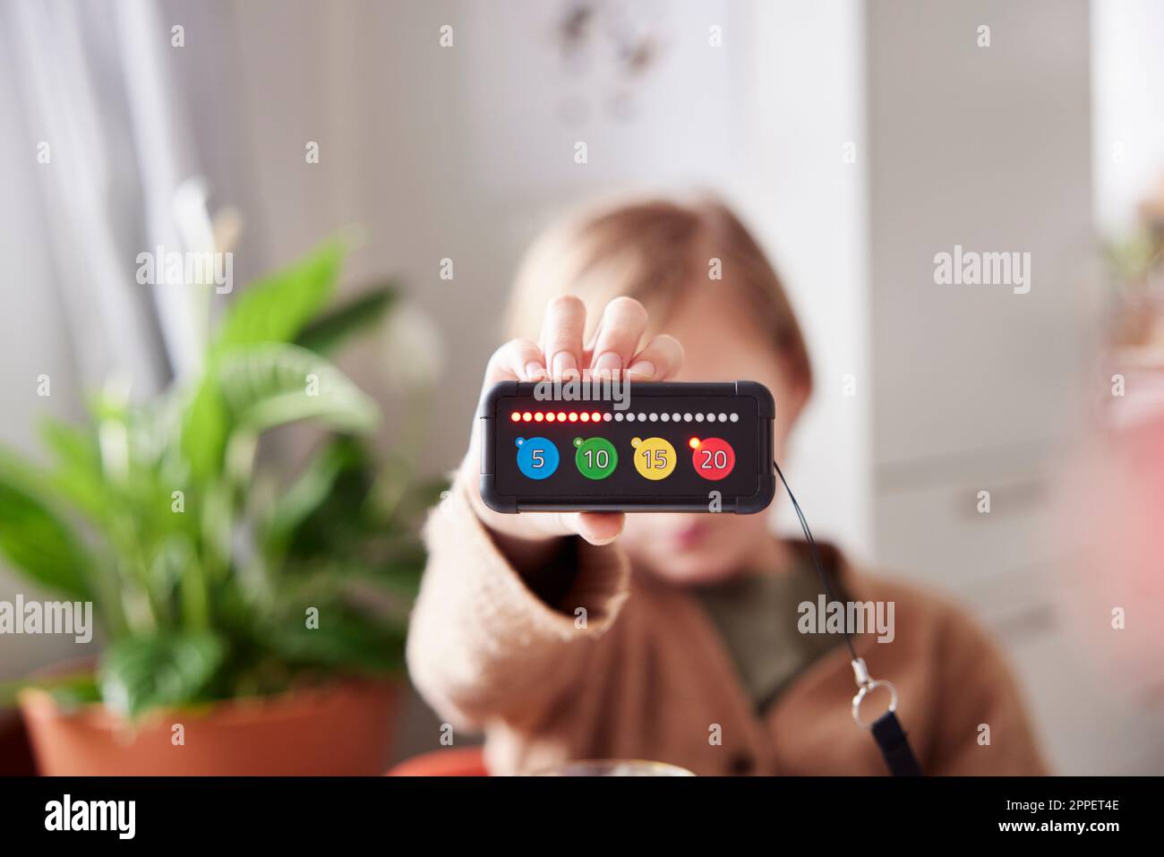Child holding educational electronic game Stock Photo