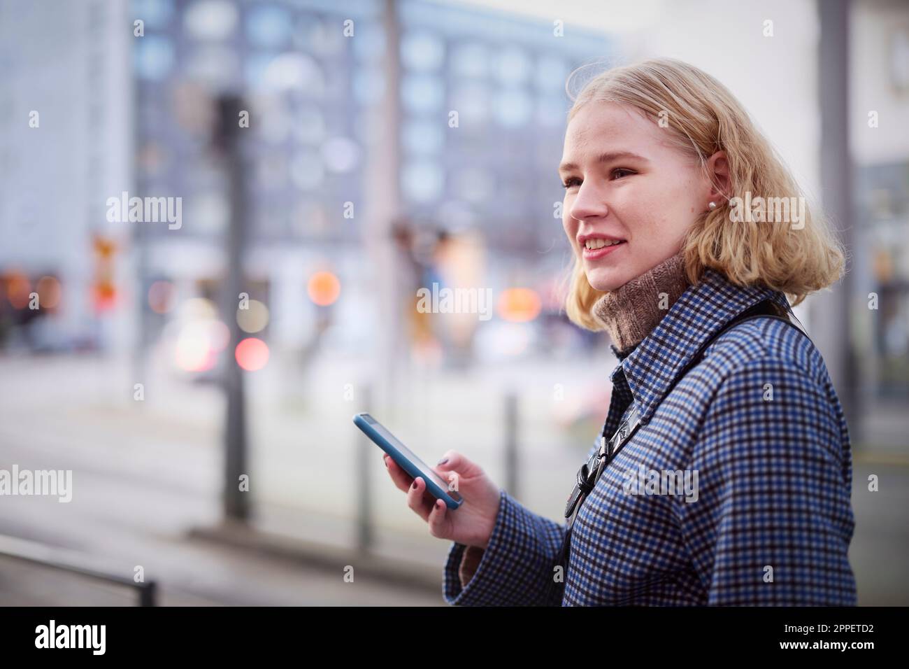 Young woman using cell phone Stock Photo