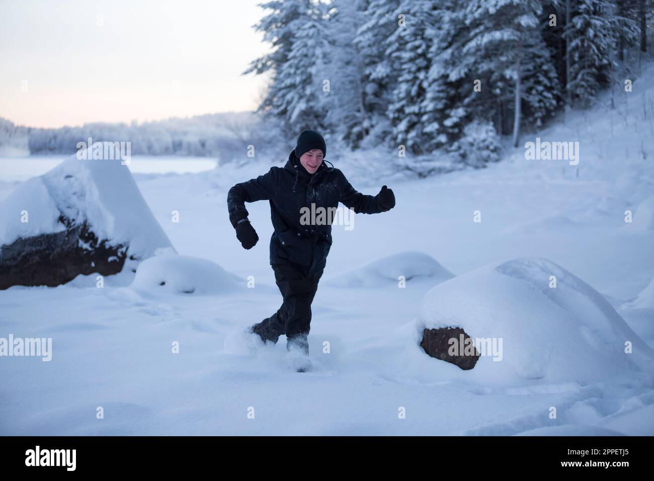 Woman playing in snow hi-res stock photography and images - Alamy