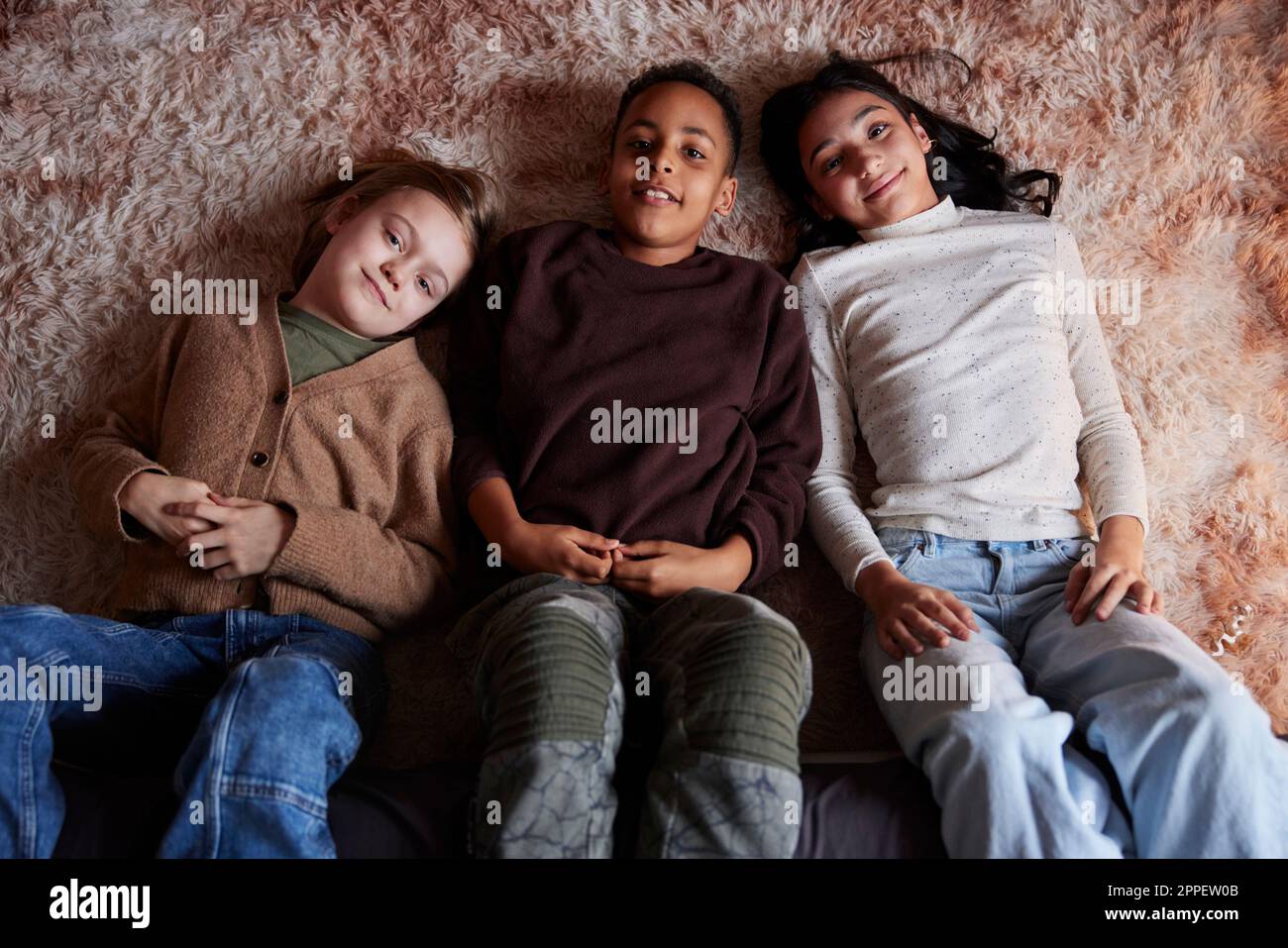 Children lying on floor hi-res stock photography and images - Alamy