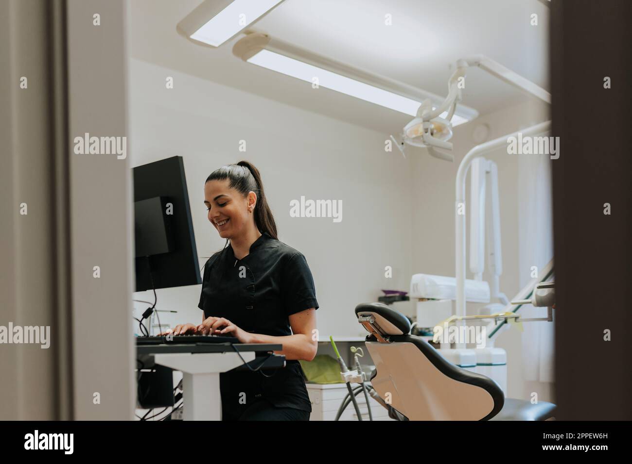 Female dentist using computer in office Stock Photo