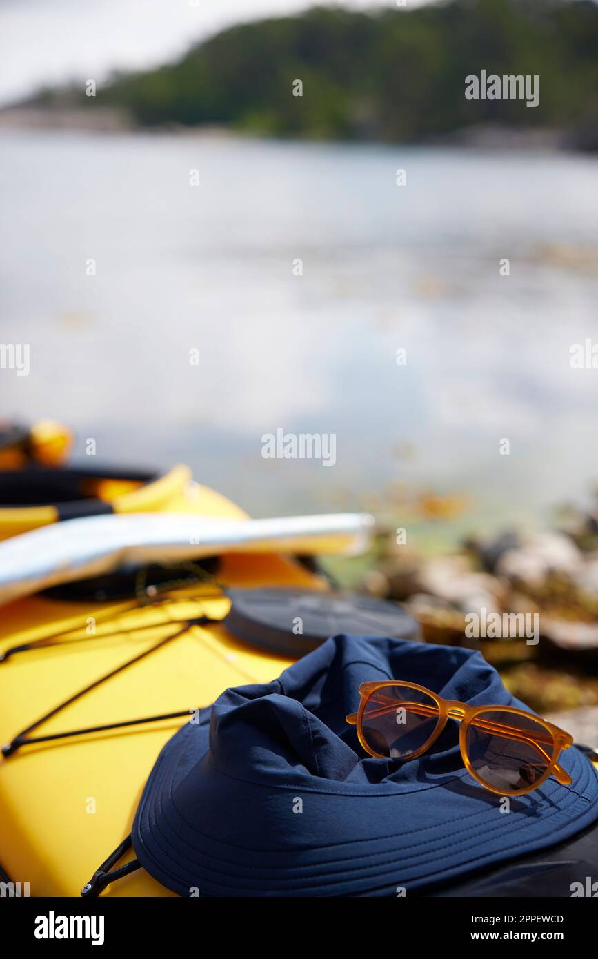Sunglasses and hat on kayak Stock Photo Alamy