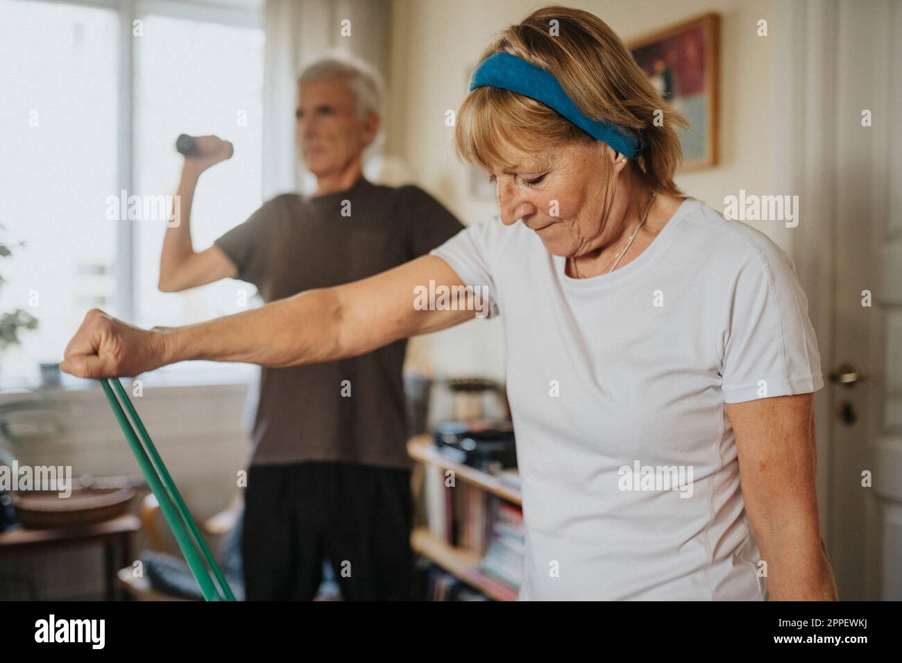 Senior couple exercising at home Stock Photo