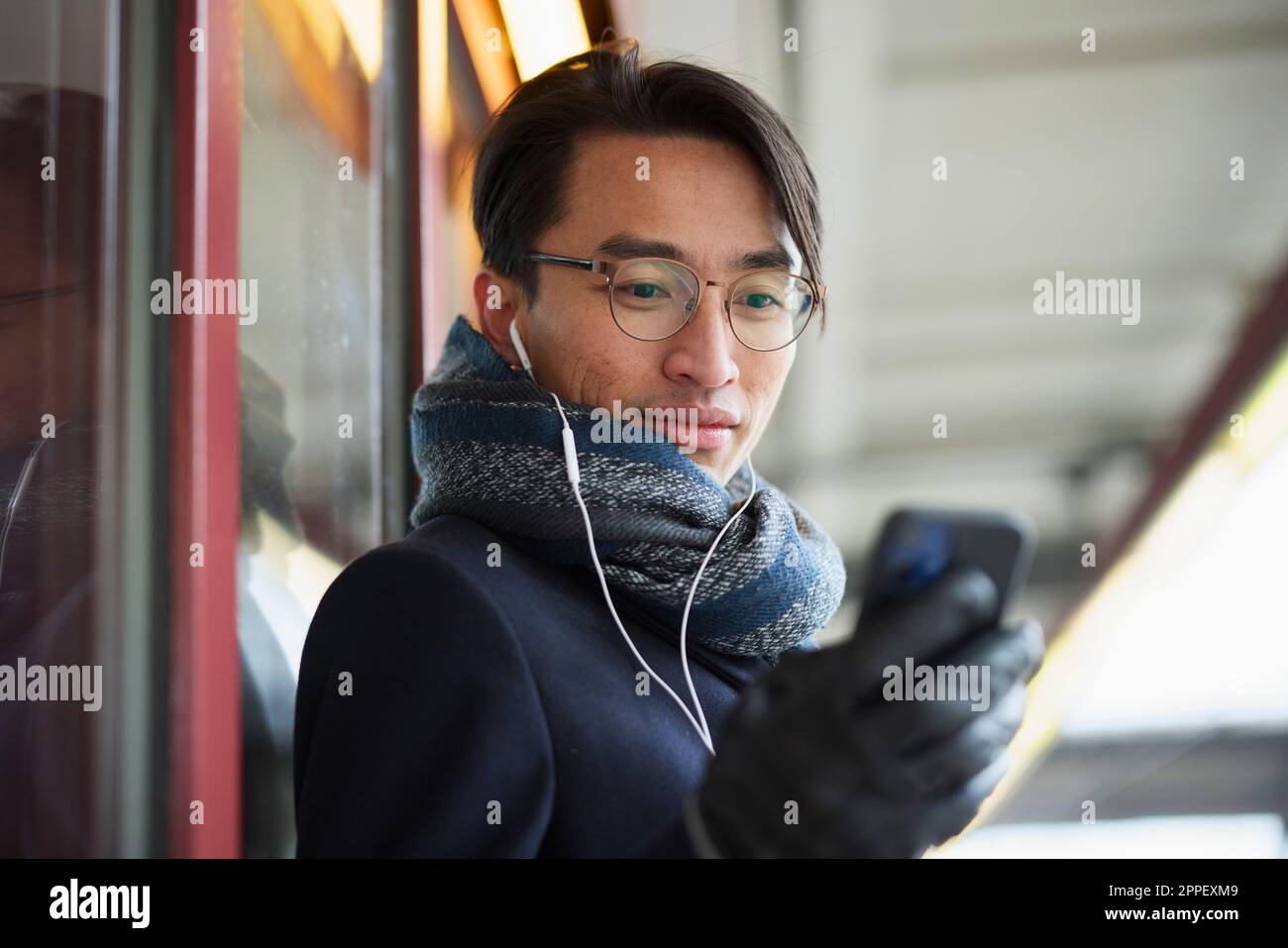 Smiling man holding cell phone Stock Photo