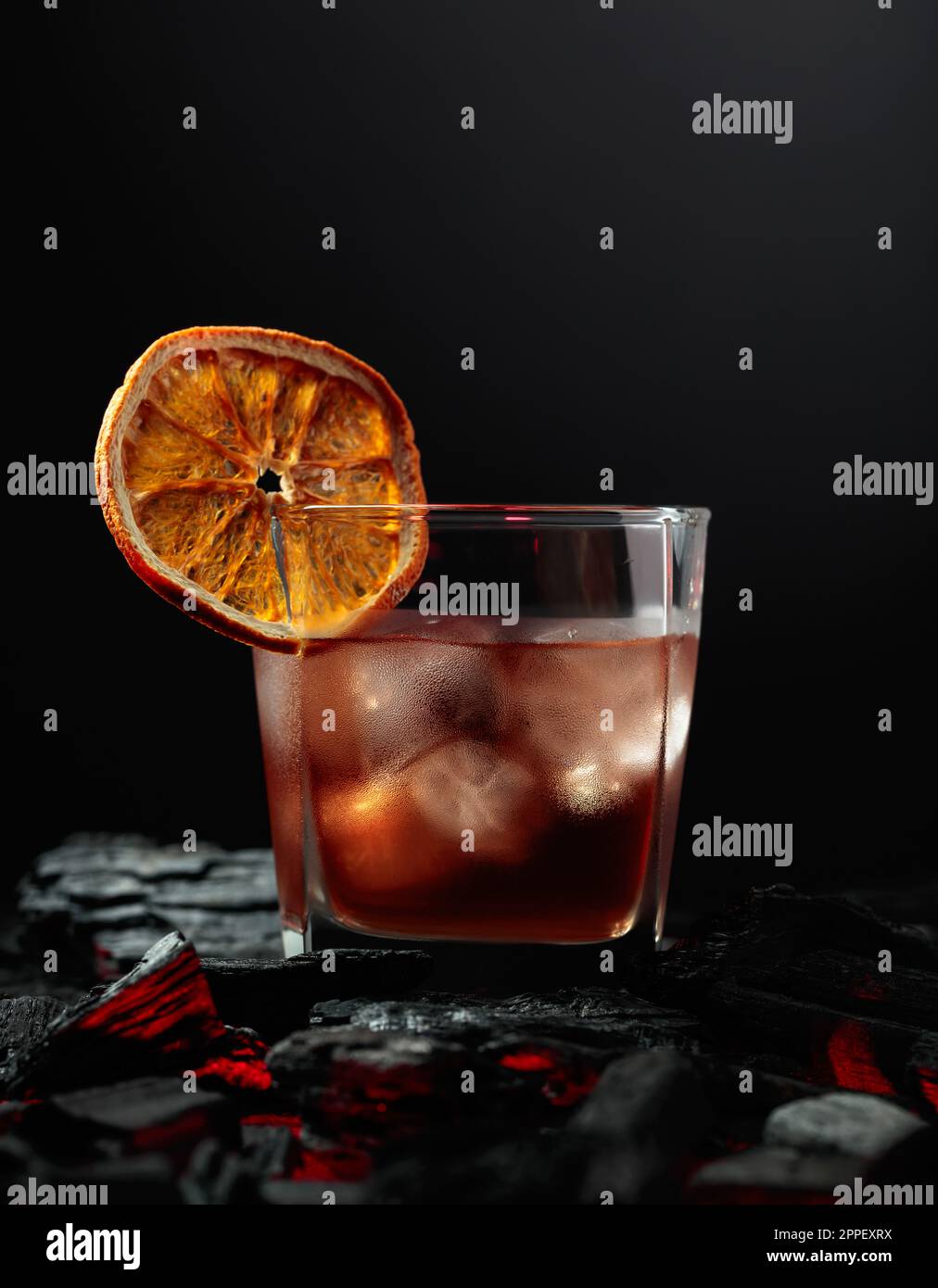 Oldfashioned cocktail with ice and dried orange slice Stock Photo Alamy