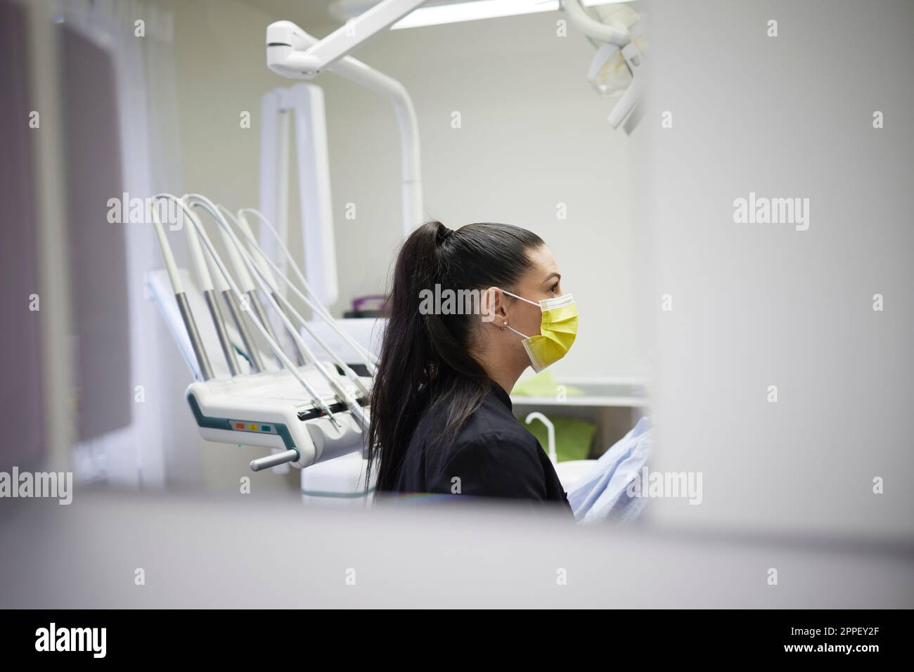 Female dentist standing in office Stock Photo
