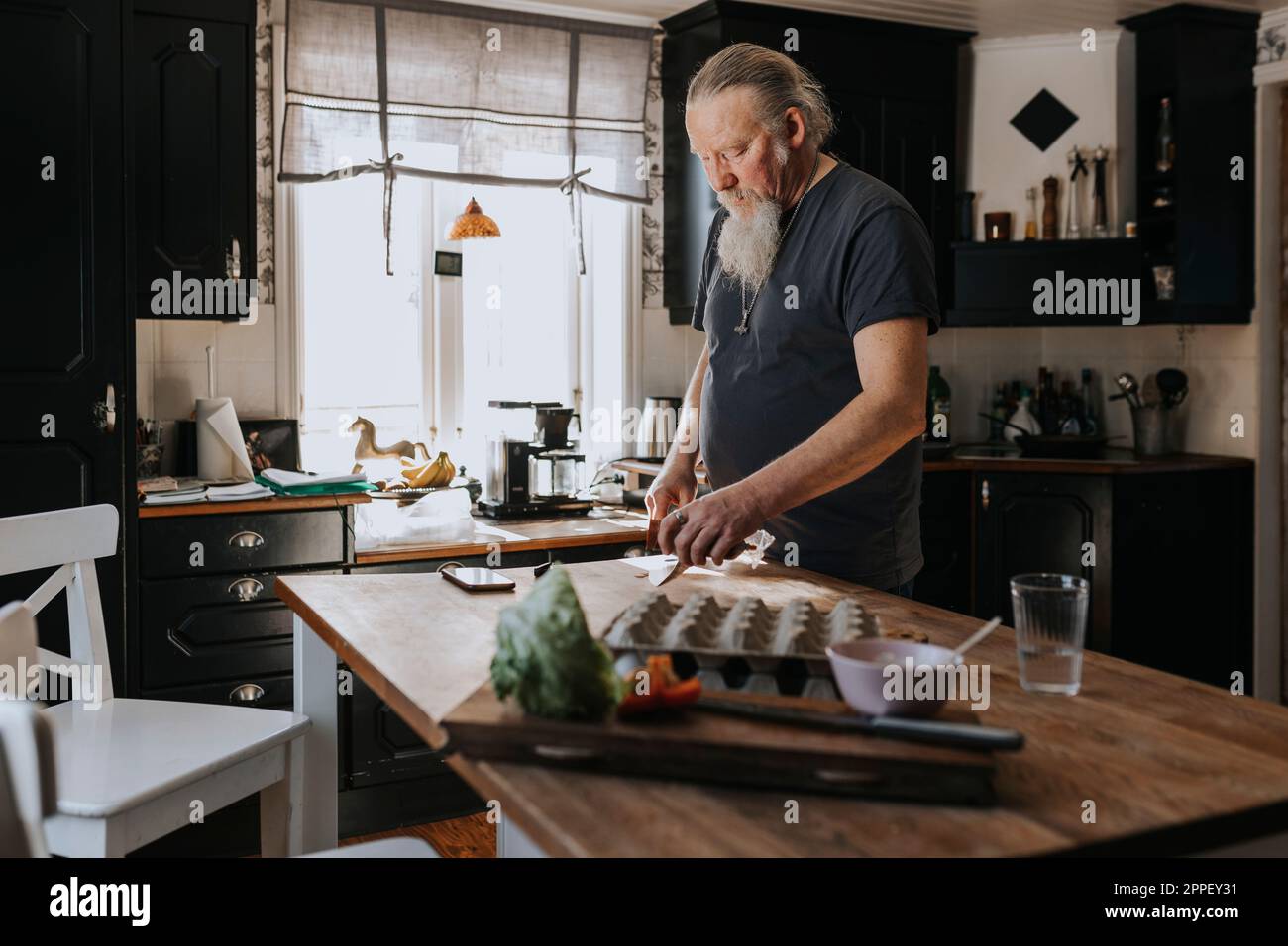 Man In Kitchen Man in gray kitchen hi-res stock photography and images - Alamy
