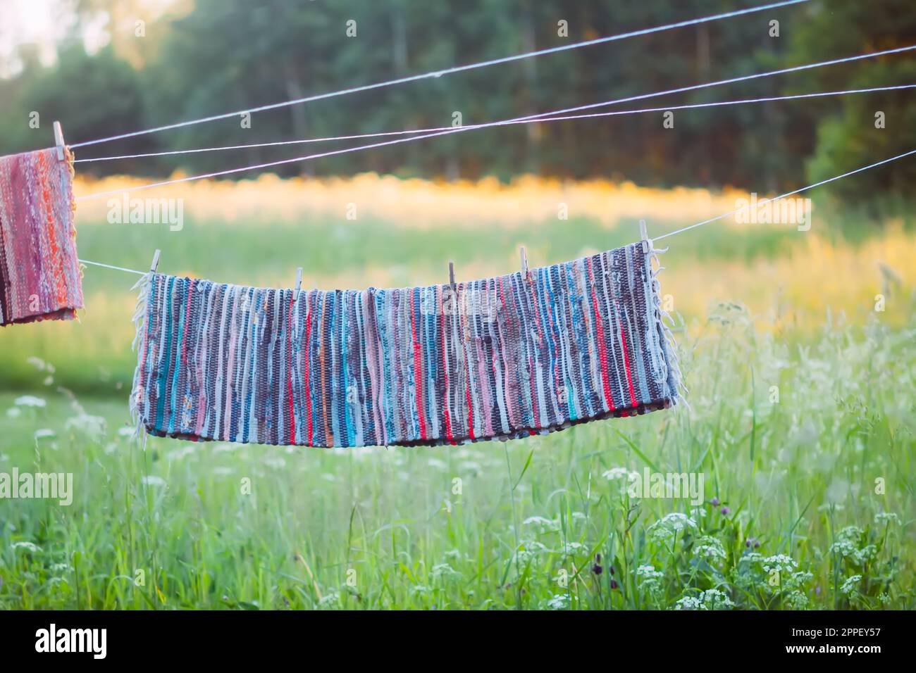 Home textile drying on washing line outdoors Stock Photo Alamy