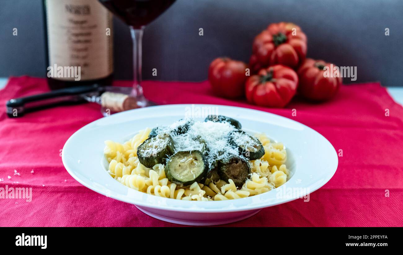 Pasta with zucchini on an italian table Stock Photo