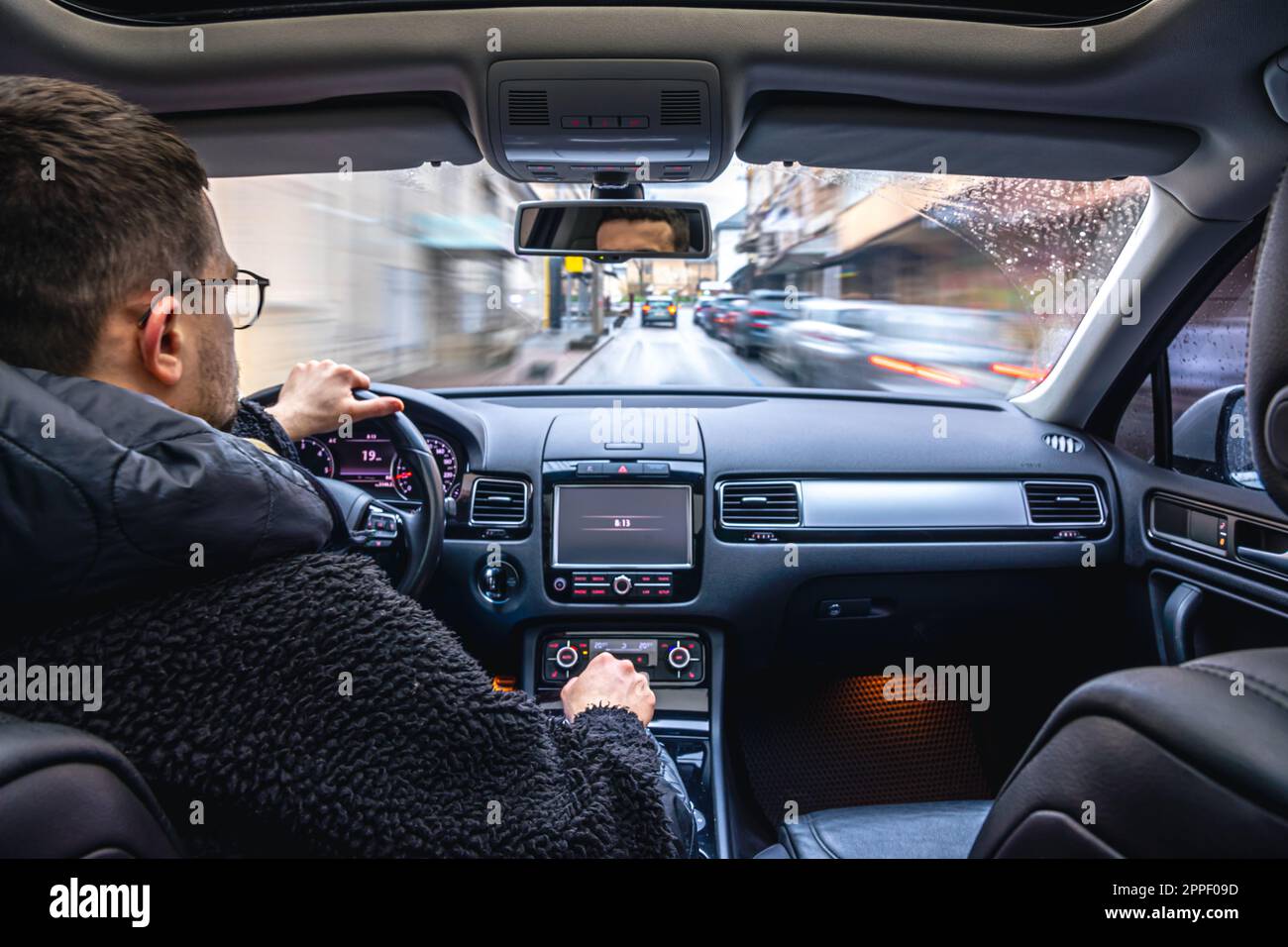Hands on the wheel when driving at high speed from inside the car Stock