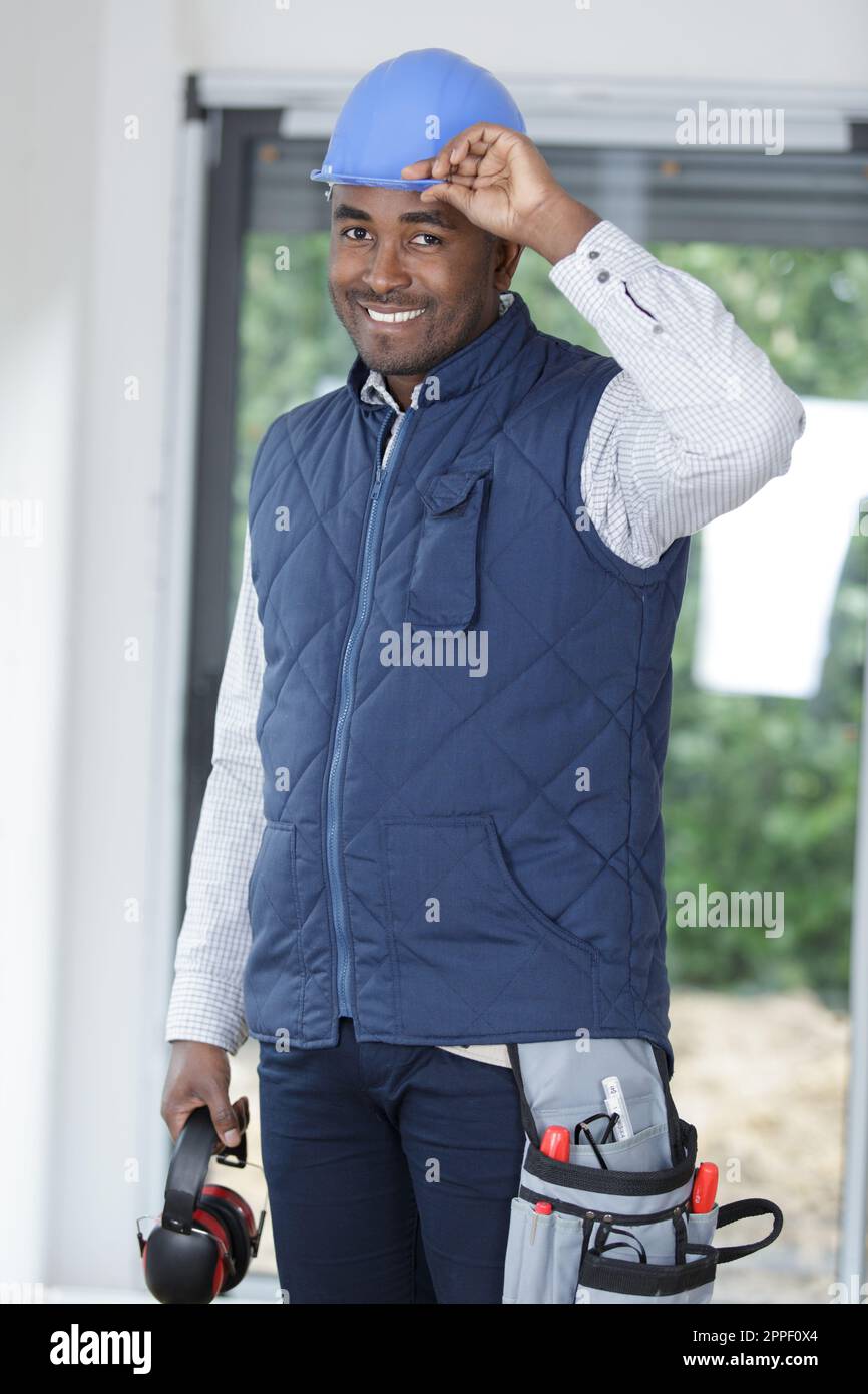 contractor construction worker tipping safety helmet Stock Photo Alamy