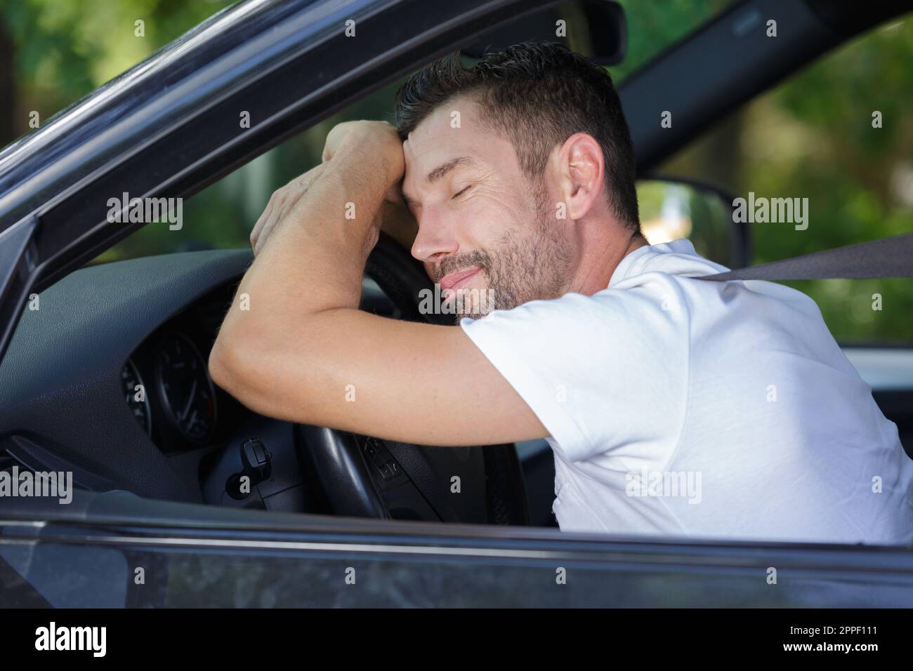 man sleep in car while driving on the road Stock Photo Alamy