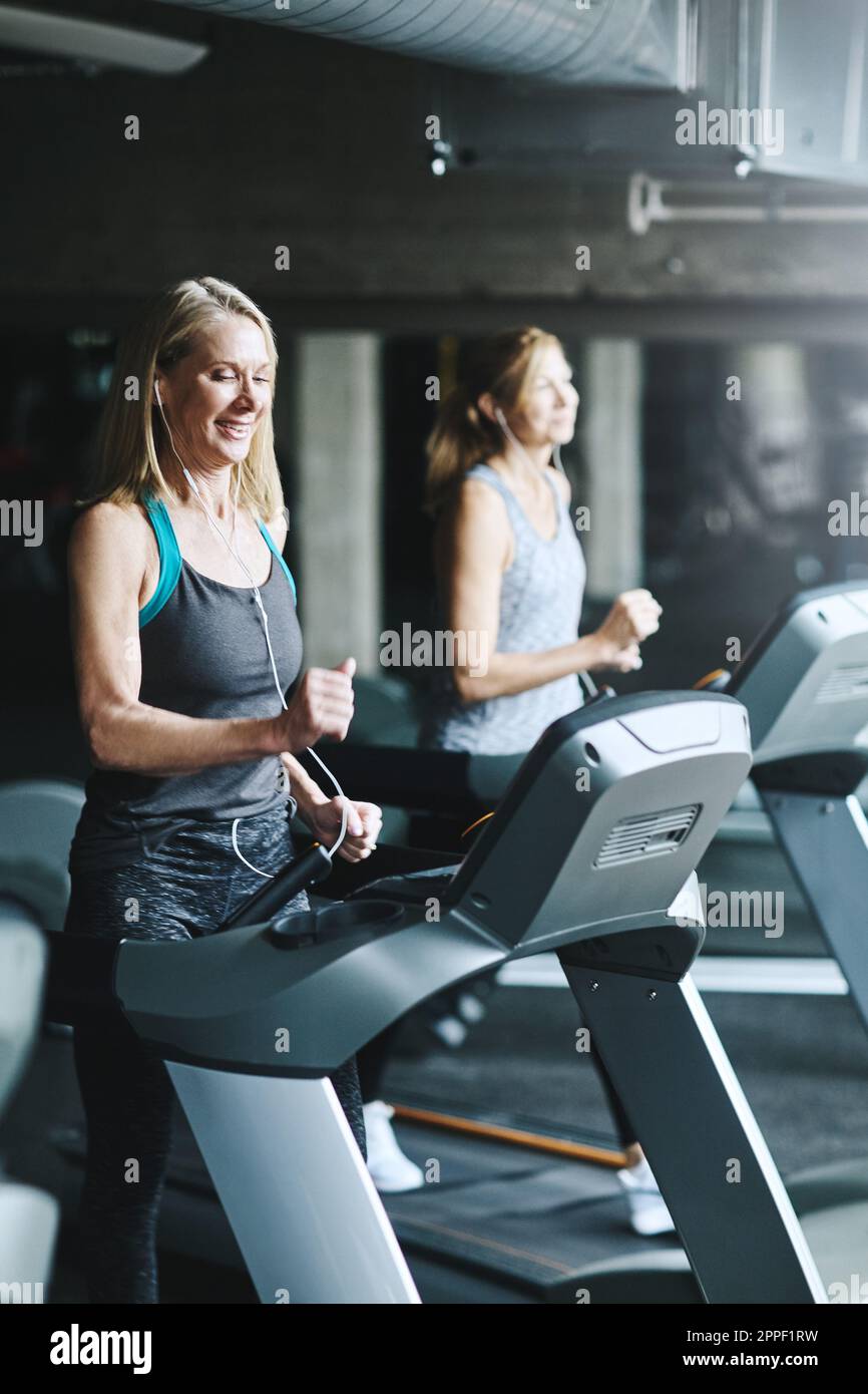if you want to age gracefully, think about getting fit. mature women working out in the gym. Stock Photo