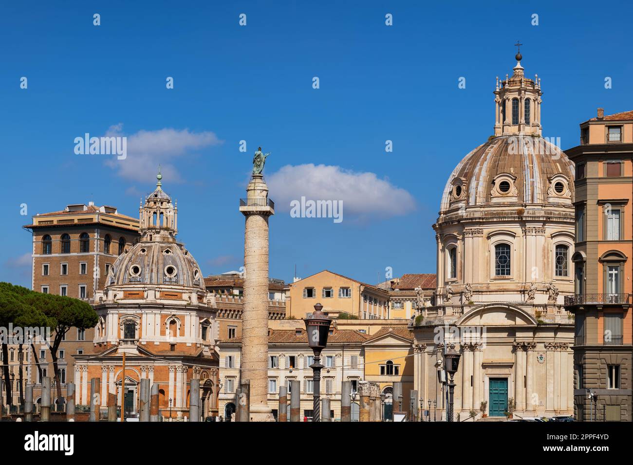 City of Rome, Italy, skyline with Trajan Column flanked by Church of Saint Mary of Loreto and Church of the Most Holy Name of Mary at the Trajan Forum Stock Photo