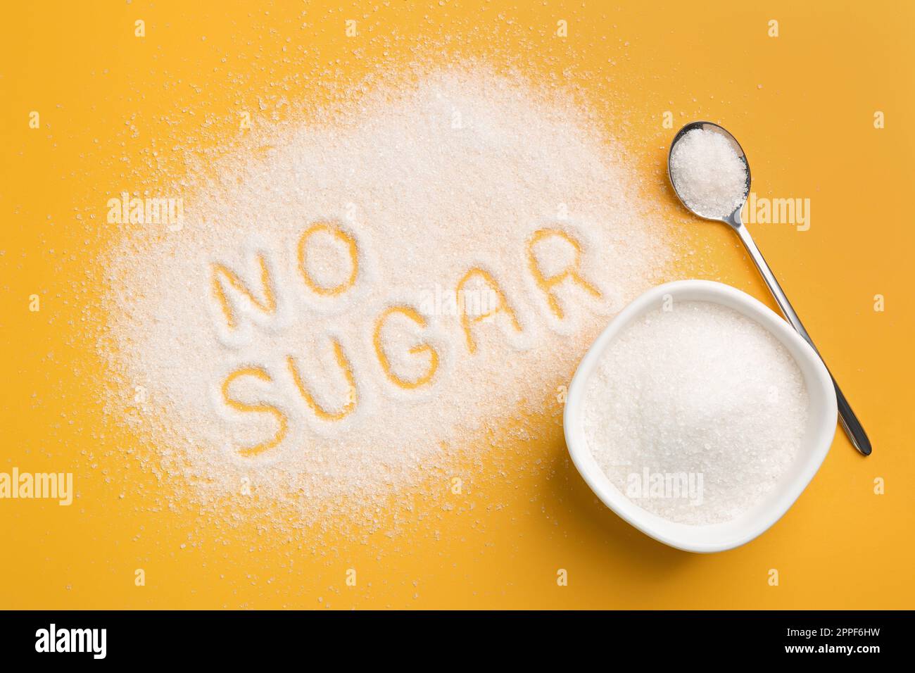 Flat lay composition with phrase No Sugar on yellow background Stock Photo