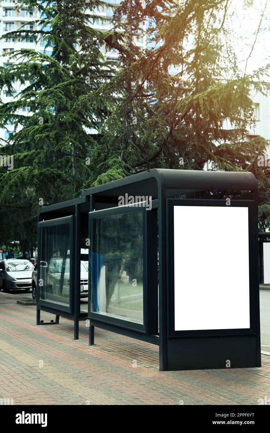 Blank advertising board on transport stop. Space for design Stock Photo ...