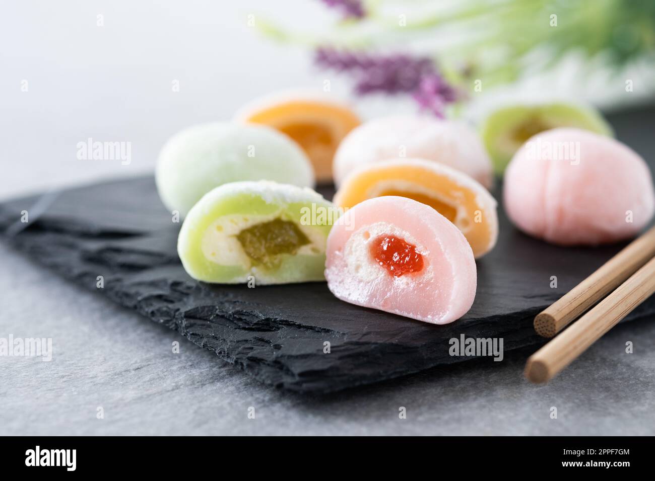 Japanese colorful mochi on gray stone surface Stock Photo