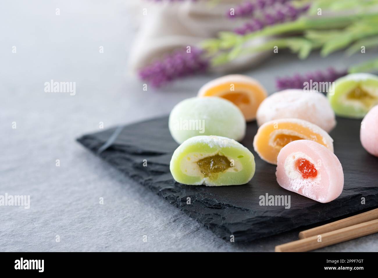 Japanese colorful mochi on gray stone surface Stock Photo