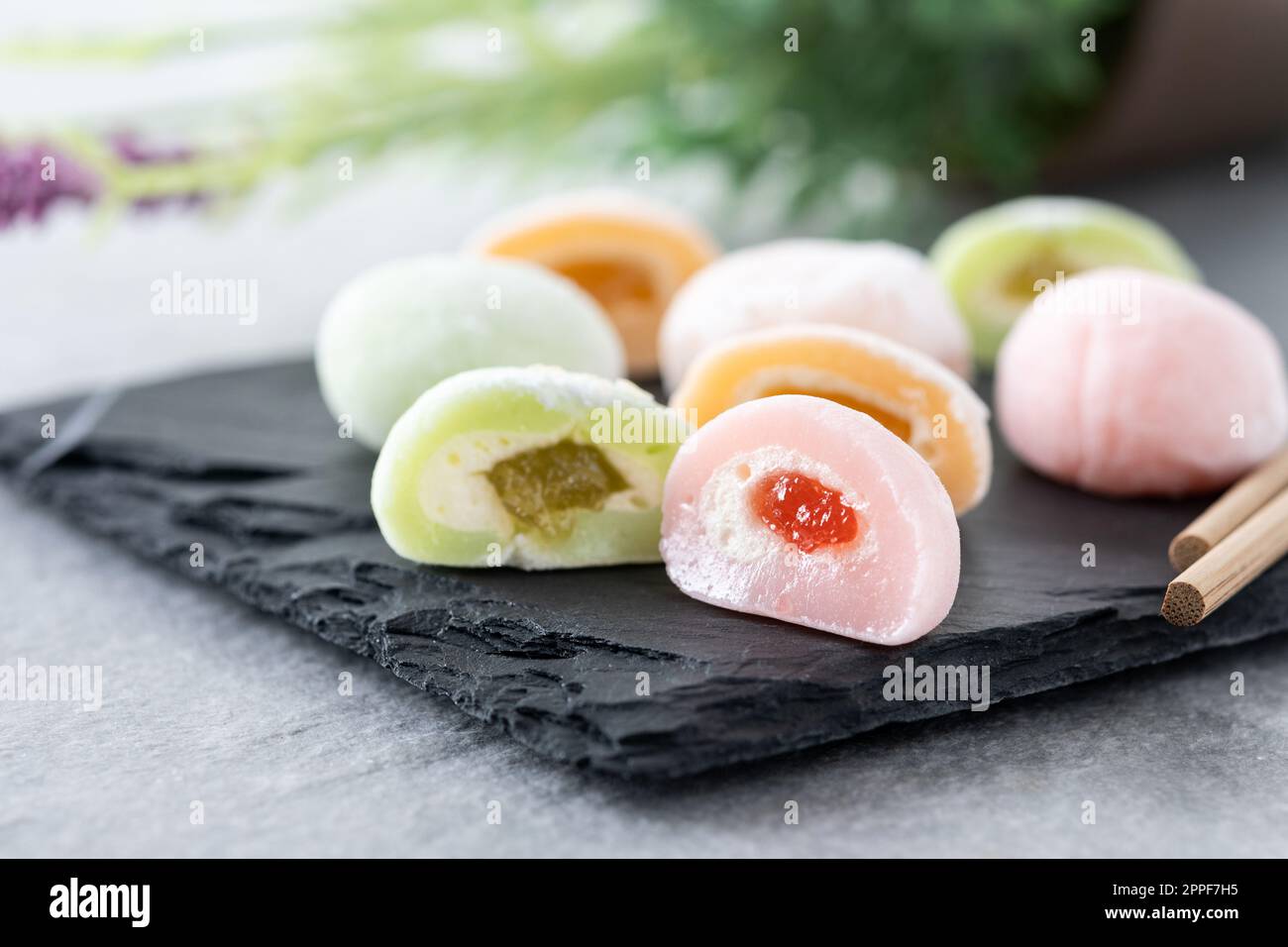 Japanese colorful mochi on gray stone surface Stock Photo
