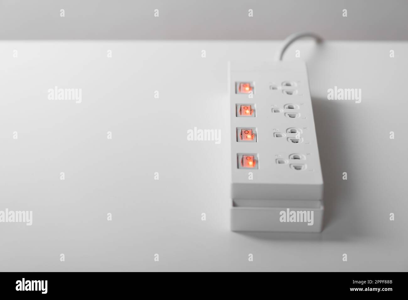 Electrical power strip isolated over white background. Stock Photo